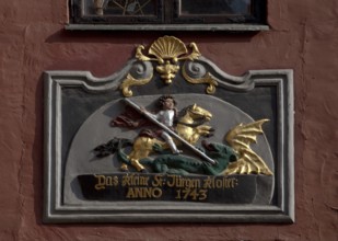 House sign, dated 1743, St George fighting a dragon The small St Jürgen monastery anno 1743, St,