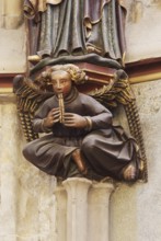 Choir hall, angel with flute as a console under the figure of Charlemagne on the eastern end wall