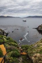 Visitors land on Cape Horn, Cabo de Hornos National Park, southernmost point of South America,