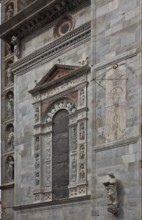 Italy Como Cathedral Gilded blind window on the south side of the west building c. 1500 accompanied