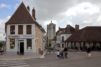 Seignealy. Tower of Saint-Martial built 10-17th century and partial view of the 17th century market