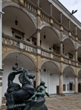 Arcaded courtyard, begun in 1544, modern bronze sculpture on the left