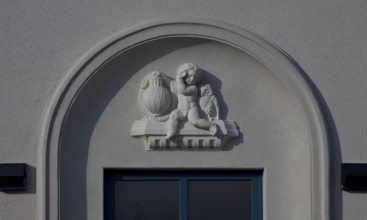 Built in 1913, IBA project 2010, exterior ornamentation, putto with lamp and owl