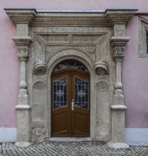 Freyburg Unstrut. House at Markt 14, Renaissance seating niche portal inscription dated 1554