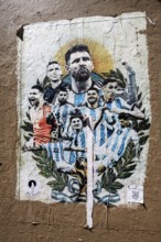 Lionel Messi with the Argentinian national team on a poster on a house wall at El Caminito, La