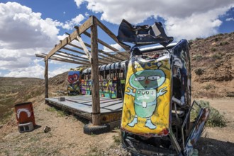 Scrap cars decorated with graffiti in the Carforest of Goldfield, Nevada, USA, North America