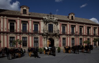 Seville, Archbishop's Palace. South façade detail with portal in front Horse-drawn carriages, St,