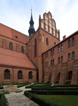 Former Cistercian church, cloister courtyard with a view of the south transept from the south-west,