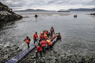 Visitors land on Cape Horn, Cabo de Hornos National Park, southernmost point of South America,