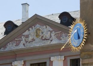 Castle courtyard, sundial and baroque pediment