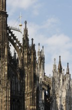 Buttress south of the choir with medieval gilded cross, St., Sankt, Saint