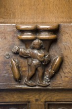 Choir stalls, drolleries on the stall sides with proverbial depictions, 1493 by Johannes Gruter