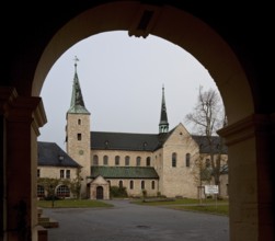 Monastery church seen from the south through the gatehouse, St., Sankt, Saint