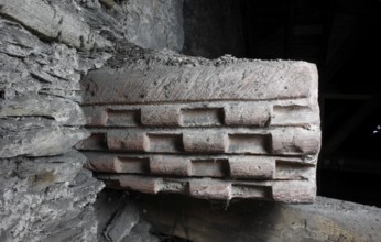 Above the choir vault, wall above the choir arch, stone with scroll frieze Church of St., Church of