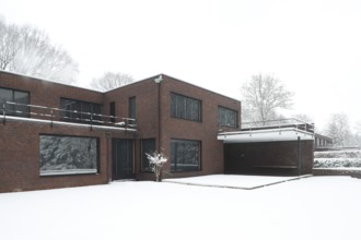 Built between 1928 and 1930 by Ludwig Mies van der Rohe as a residential building, garden side