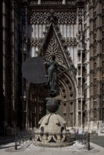 Seville, Cathedral. South portal in front of it Original of the bronze sculpture crowning the bell