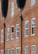 Built 1734-1742 for Dutch craftsmen, gable and façade detail with scroll, downpipe and windows