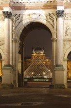 Arc de Triomphe du Carrousel and inner courtyard of the Louvre with pyramid by Ieoh Ming Pei