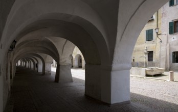 Italy S-Tyrol Neumarkt. Laubengasse with a view of the alleyway fountain