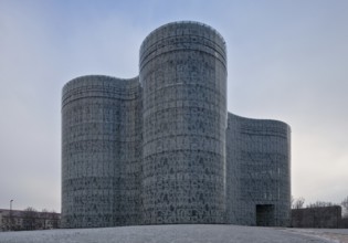 Technical University, Library by HERZOG & de MEURON 1998-2004, exterior view at dusk