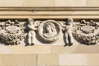 Façade details after the 2016 renovation, west side, homage to Hans Holbein