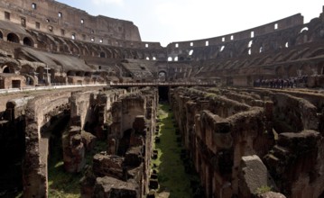 Interior with wall remains below the former arena