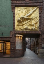 Bremen, entrance to Böttcherstraße, with the façade relief The Lightbringer by Bernhard Hoetger