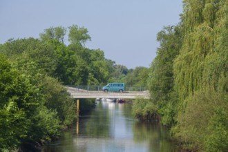 Road bridge with delivery van over the river Wümme in spring, Lower Saxony, Germany, Europe