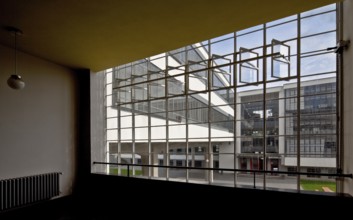 View through the stairwell window of the former vocational school between the ground floor and