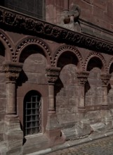 Base area at the choir with Romanesque arcade and elephant sculpture, St., Sankt, Saint