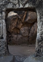 Artificial cave rooms, portal chiselled out of the bedrock