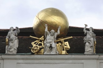 Stone atlas on the gable of the Court Library, now the National Library Globe, globe, golden,