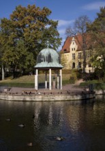 View across the pond to the pond arbour and castle