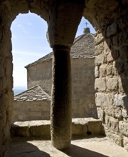 Castle, Queen's Tower, Romanesque biforium with a view of the crossing tower of the monastery