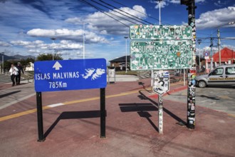 Town sign Ushuaia and distance sign to the Falkland Islands, Argentina, South America