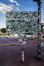 Town sign pasted over with sticker, Ushuaia, Argentina, South America