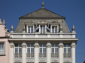 Three-storey corner residential and commercial building with Louis Seize façade, neoclassical