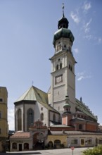 Austrian Hall in Tyrol. St Nicholas exterior view from ONO. Gothic parish church, St., Sankt, Saint