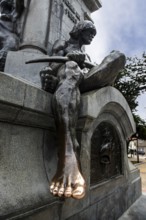 Foot of the indigenous Aonikenk being kissed by tourists, Magellan Monument, Plaza de Armas, Punta