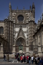 Seville, Cathedral. South portal in front of it Original of the bronze sculpture crowning the bell