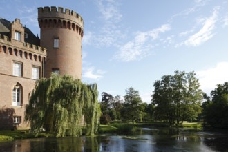 West tower and castle pond in the evening light