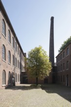 Former Neuwerk cloth factory, inner courtyard with chimney