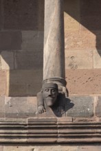 Worms, St Peter's Cathedral, east choir, figure on the dwarf gallery with stonemason's mark