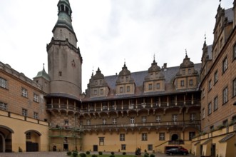 Courtyard view, tower and east wing with loggias and dwarf houses