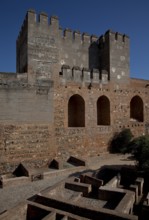 Alcazaba fortress, inner courtyard with Torre Quebrado, building floor plans exposed below