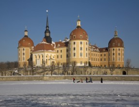 Winter, tobogganing on the frozen lake, sledging, tobogganing, winter sports