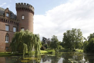 West tower and castle pond in the evening light