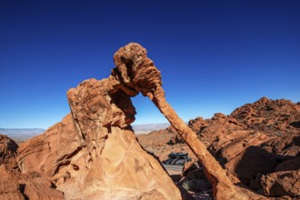 Motorhome driving below Elephant Rock, Valley of Fire State Park, Nevada, USA, North America