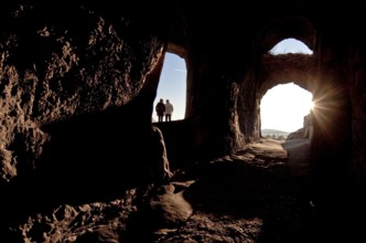 Artificial cave rooms, rock passage inside to the south-west with people