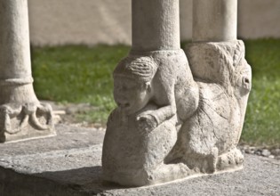 Eastern cloister wing, column base, Woman biting the lion's tail, St., Saint, Saint